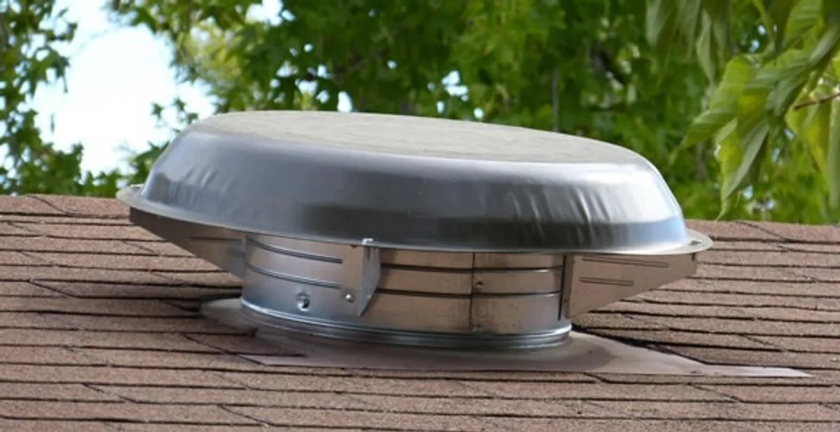 attic fan installation services with low-profile roof ventilation unit in Bloomington, IN