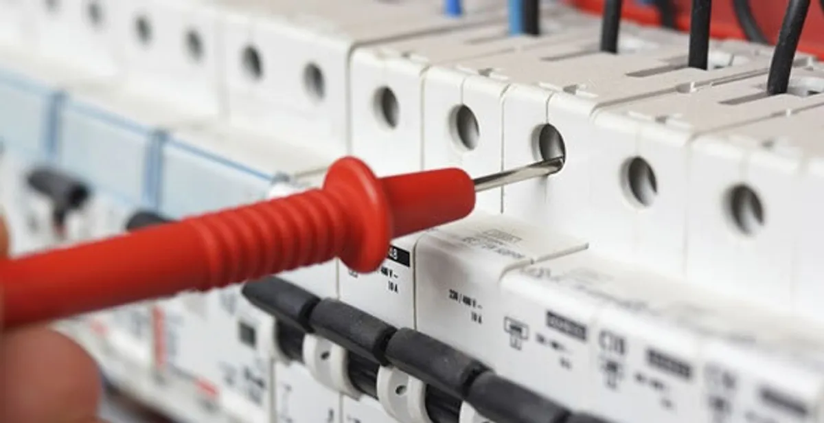 Electrical contractor testing circuit breakers during electrical repair in Unionville, IN