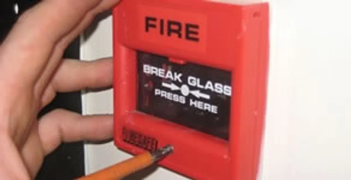 fire alarm installation service showing manual fire alarm pull station installed by licensed electricians in Bloomington, IN