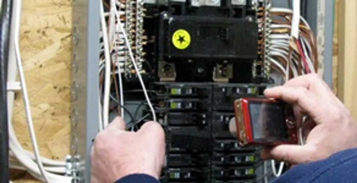 Home electrical inspection of circuit breaker panel by licensed electrician in Bloomington, IN