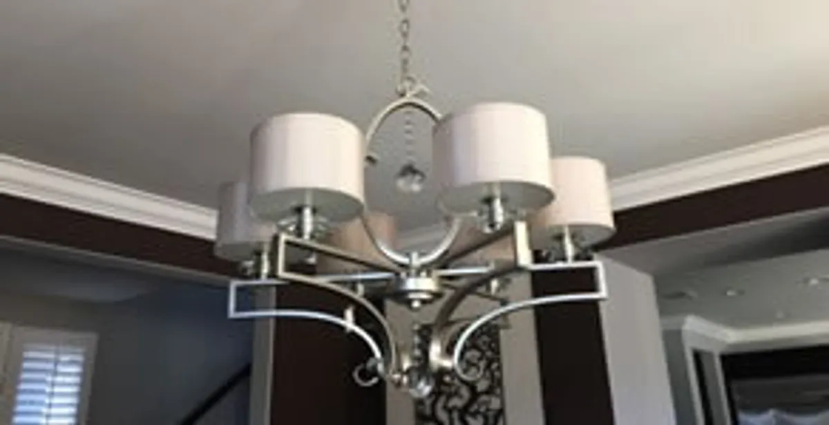 Modern chandelier installation with multiple light fixtures in Bloomington, IN