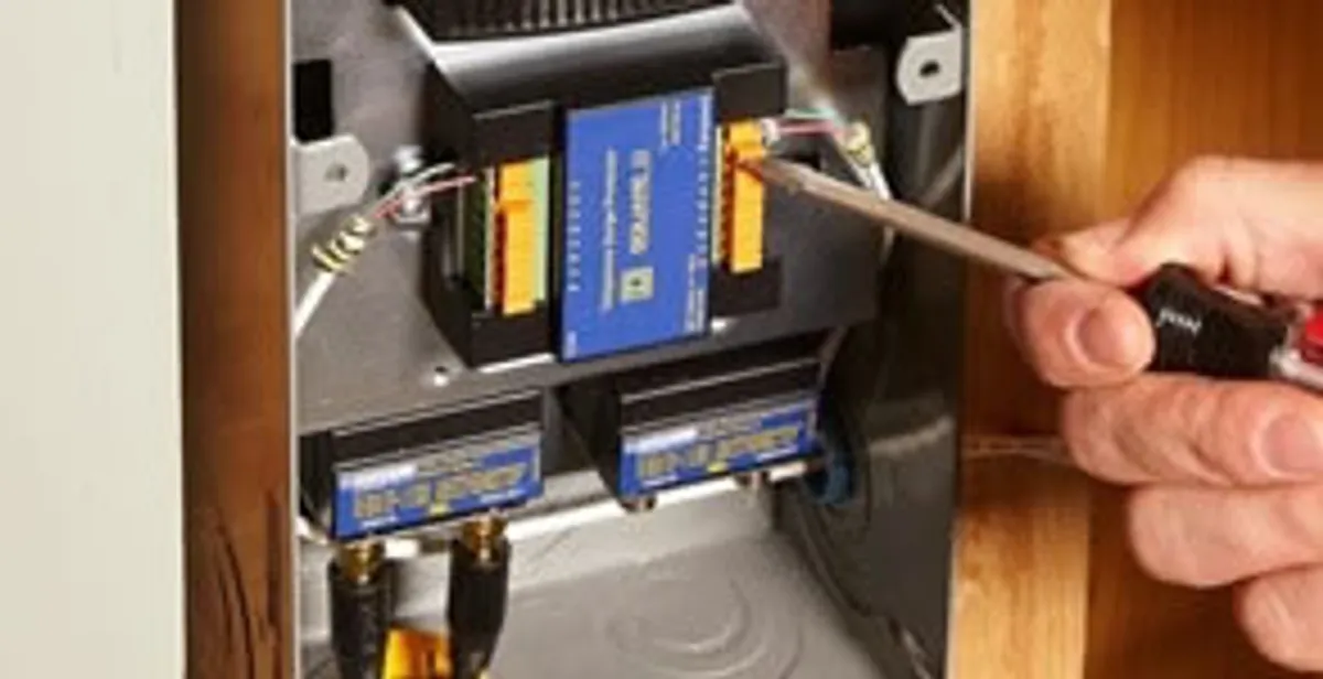 Whole home surge protection device being installed by a licensed electrician to protect electrical systems in Bloomington, IN